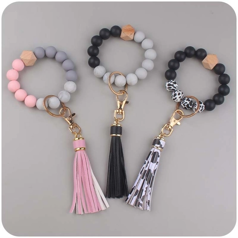 Portachiavi da Polso con Perline in Silicone per Donna Moda Nappa in Pelle PU Bracciale con Perla in Legno Regalo Accessorio