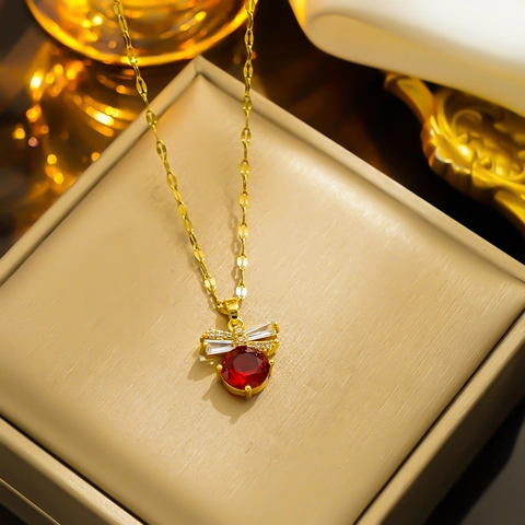 Elegante Collana con Ciondolo a Fiocco in Acciaio al Titanio Con Strass Bianchi Catena Placcata in Oro Gioielli da Donna