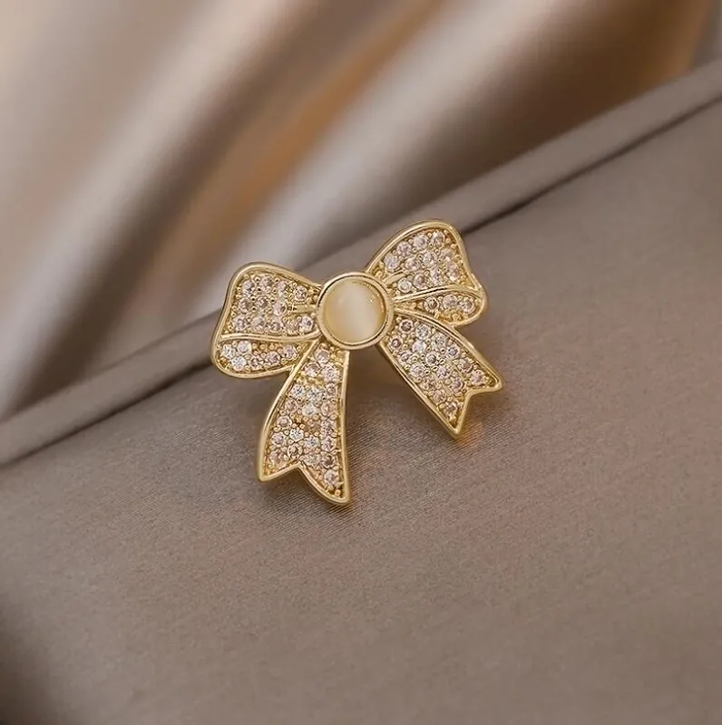 Japanese Sweet Bowknot Brooch For Women Alloy Rhinestone Inlaid Artificial Cat Eye Stone Anti-exposure Pin Fashion Accessory