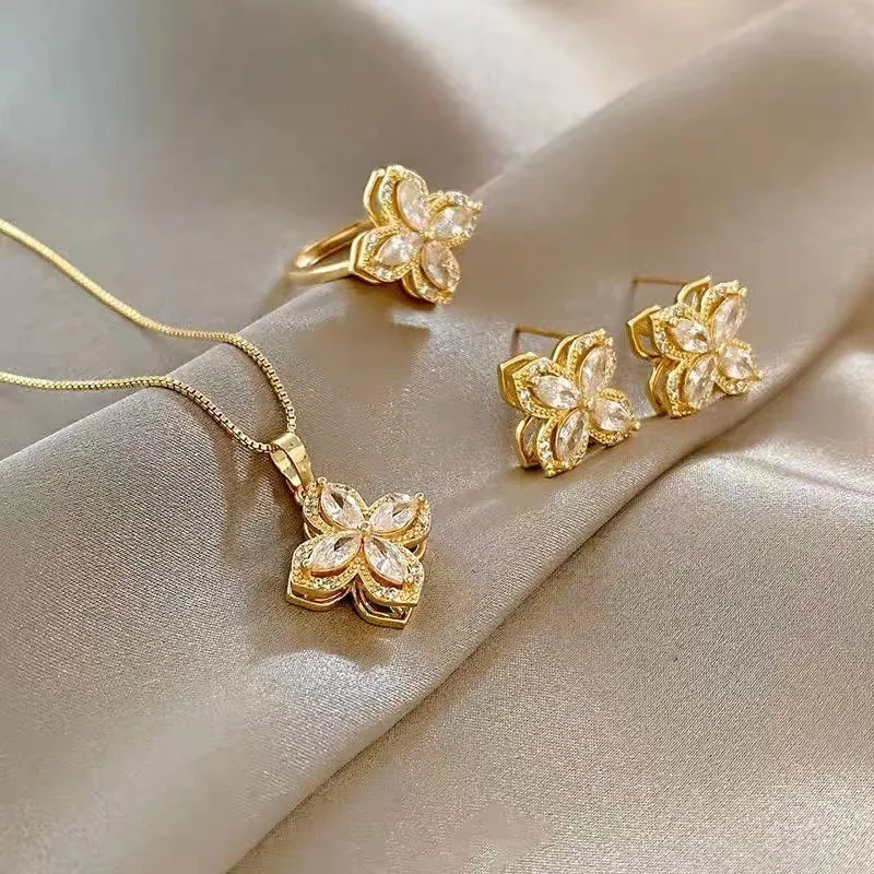Bijoux Trèfle À Fleurs Rotatives Collier Boucles D'oreilles Et Bague Ouverte Acier Titane Zircon Style Élégant Femmes