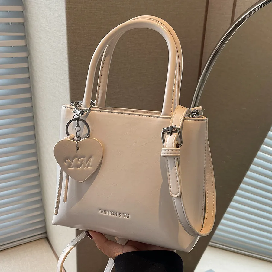 Fashion Women PU Leather Bucket Bag Minimalist Small Square Shoulder Crossbody Handbag With Heart Pendant For Daily Use