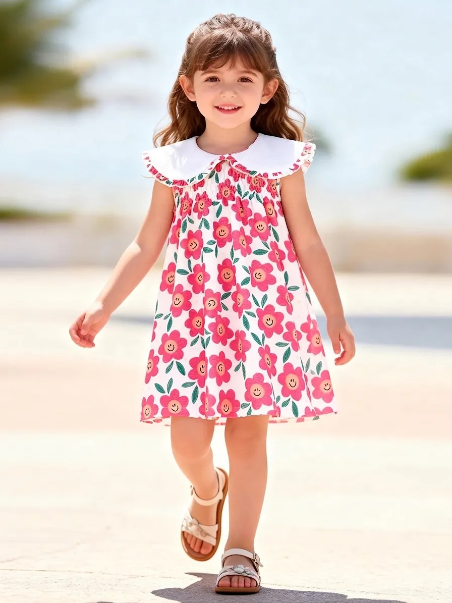 Abito Little Maven da Ragazza Estivo Senza Maniche con Colletto Peter Pan Stampa Fiori Rosa e Faccine Sorridenti in Seersucker