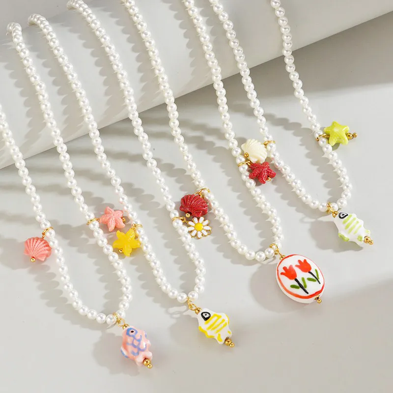 Collier de Künstliche Perles Style Français Acier Inoxydable Plaqué Or Chaîne Perlée Pendentif Fleur Étoile de Mer Coquillage Bijoux d'Été Femme
