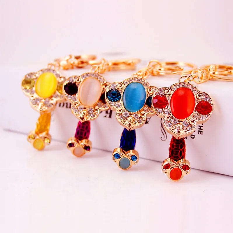 Portachiavi Vintage in Stile Cinese Ruyi Chiave in Lega di Zinco con Strass e Pietra Occhio di Gatto Pendente per Borsa Donna