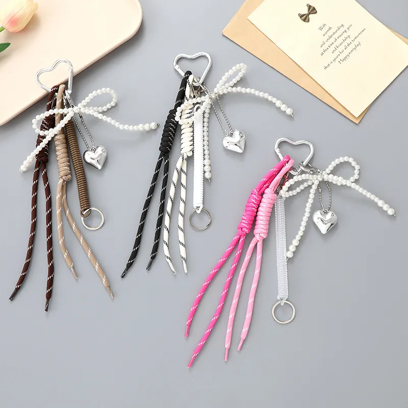 Porte-clés Nœud en Cœur en Corde Tressée Charme de Sac avec Fausse Künstliche Perle Fermoir Cœur Accessoire pour Femmes