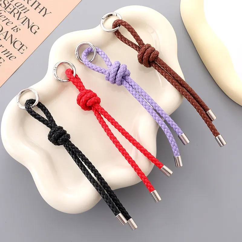 Porte-Clés en Cuir PU Tressé Main pour Femmes Accessoire de Téléphone Pendentif de Sac en Corde Tressée Polyvalent Anneau de Clé à Nœud Élégant