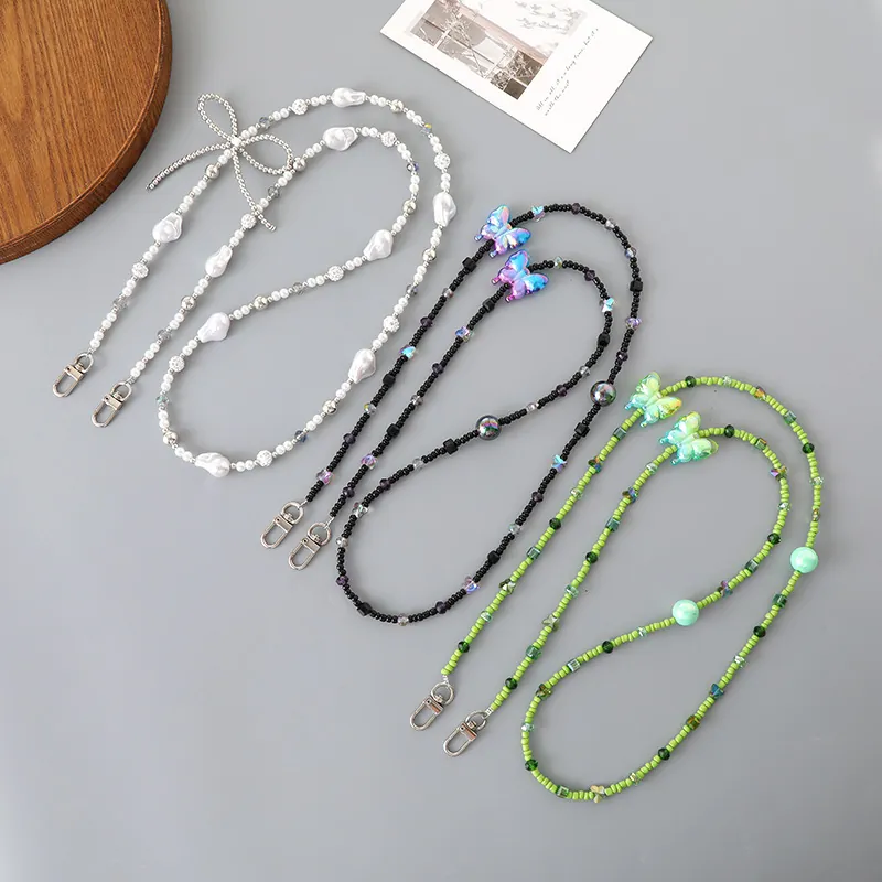 Cordon de Téléphone à Künstliche Perles à la Mode Bandoulière Papillon Nœud Acrylique Künstliche Perle Chaîne pour Femmes Sac Décoration