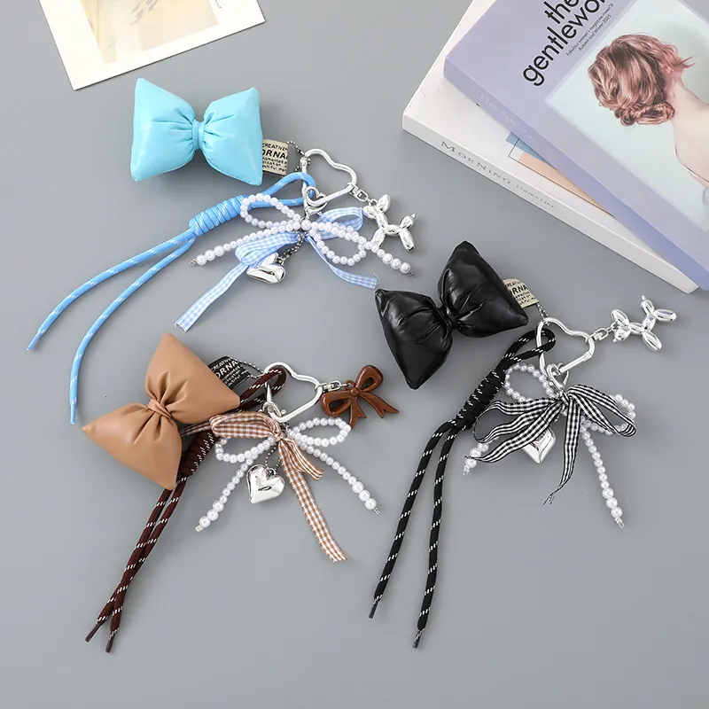 Charme de Sac en Similicuir à Nœud Papillon Cœur Fausse Künstliche Perle Corde Tressée Porte-clés pour Femmes Décoration de Sac à Main