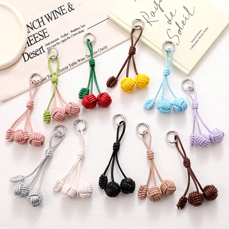 Porte-Clés en Cuir PU Tissé à la Main avec Nœud de Balle Charme de Sac Mode Lanière de Téléphone Colorée Accessoire