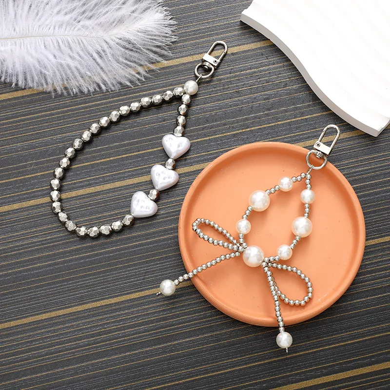 Porte-clés à Nœud Papillon et Cœur en Künstliche Perles de Mode Pendentif de Téléphone Portable à Nœud en Künstliche Perles pour Femmes Accessoires de Pendentif de Sac Élégants