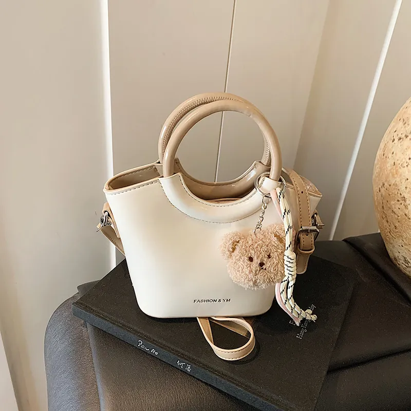 Women PU Leather Bucket Bag With Round Handle Fashion Crossbody Shoulder Bag With Bear Pendant Daily Commute Handbag