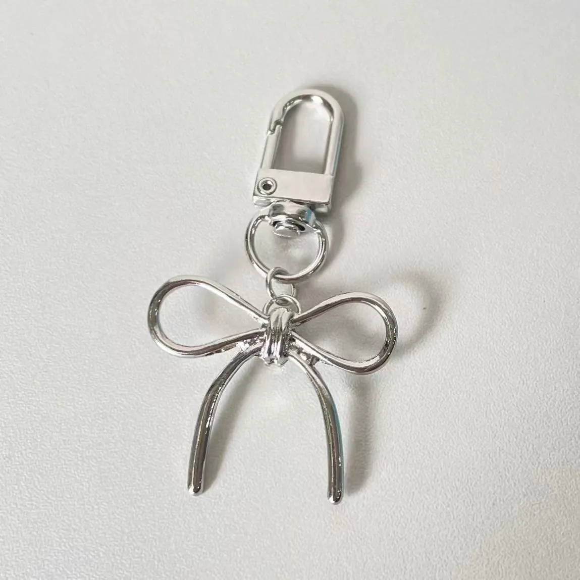 Silver Zinc Alloy Bow Tie Bag Charm For Women Korean Style Minimalist Metal Keychain Accessory For Phone Keys Jewelry