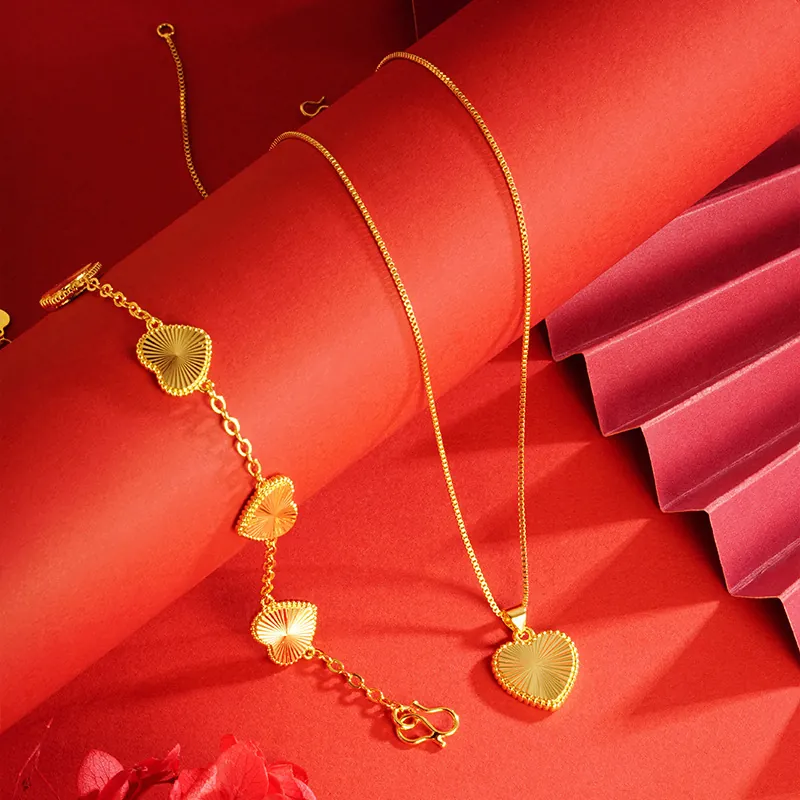 Elegant Gold Plated Copper Heart Pendant Necklace And Bracelet Jewelry Set For Women With Sunburst Texture Detail