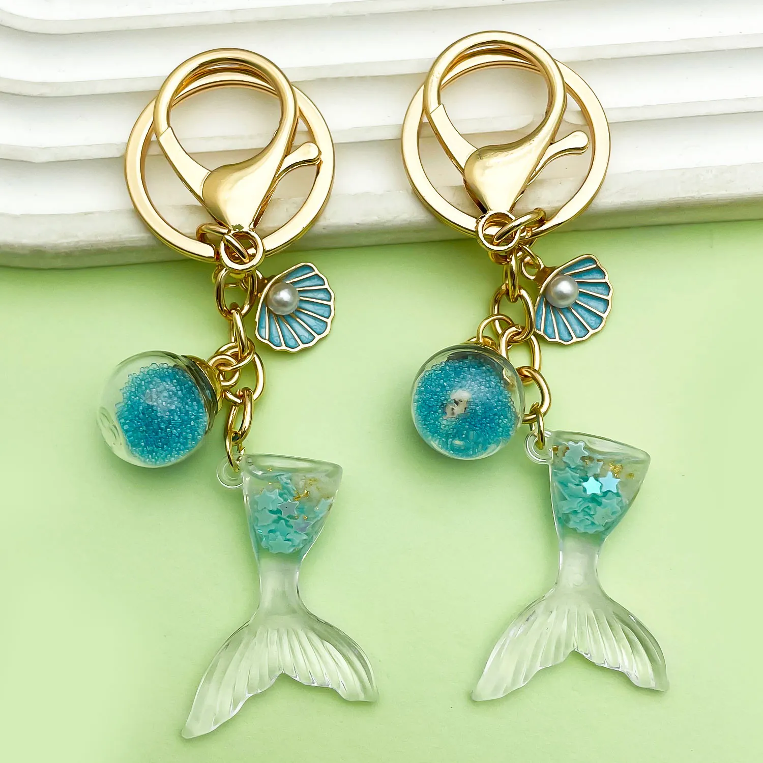 Llavero de Aleación Temática Oceánica Cola de Sirena Estrella de Mar Concha Colgante de Resina Perla Artificial Esmalte Amuleto de Bolso