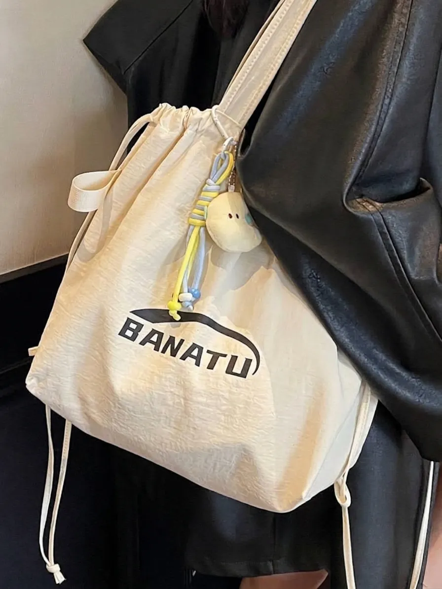 Women Large Capacity Canvas Tote Bag 2025 New Commuter Backpack Drawstring Multi-functional Shoulder Bag With Cartoon Pendant