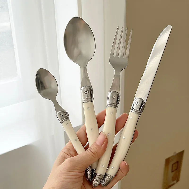 Korean Style Creamy White Curved Handle Stainless Steel Cutlery Set Vintage Laguiole Style Mirror Polished Steak Knife Fork Spoon Set For High Grade Dining Tableware