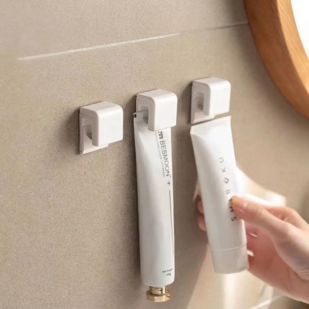 Wall-Mounted White ABS Plastic Toothpaste Facial Cleanser Storage Clip Punch-Free Bathroom Organizer Rack Hanging Holder