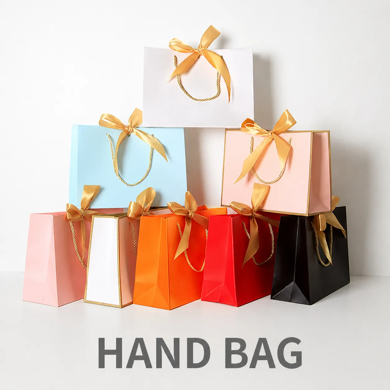Elegant White Cardboard Bowknot Paper Gift Bag With Gold Bronzing Ribbon Handle For Wedding Party Shopping Packaging