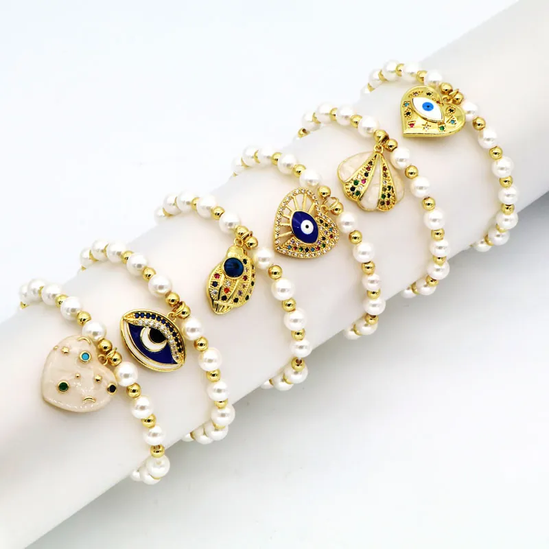 Evil Eye Künstliche Perlenarmband Mit Imitationsperle Und Vergoldeten Kupfer Herz Muschel Zirkon Anhängern Für Frauen