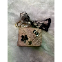 5-star customer review photo by S*****e, image 2 of 3 for Quilted Wave Pattern PU Leather Handbag With Bow Charm