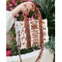 5-star customer review photo by F*****r, image 1 of 1 for Bohemian PU Leather Crossbody Bag With Floral Embossing For Women